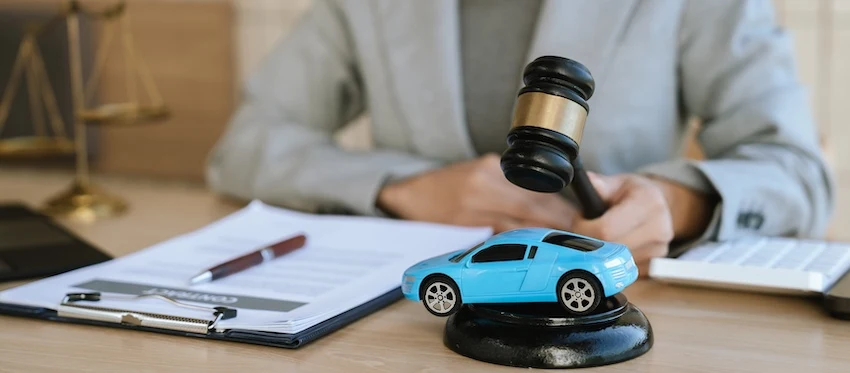 A female attorney is closing a car accident case at Amircani Law.