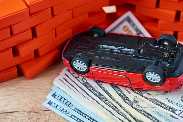 compensation from a car crash in Atlanta, crashed car with money