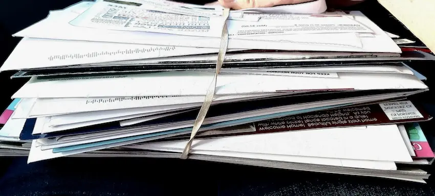 Stack of medical bills, hospital records, and treatment receipts from car accident injuries used to calculate settlement value