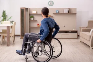 Compassionate Georgia spinal cord injury lawyer meeting with wheelchair-using client and family